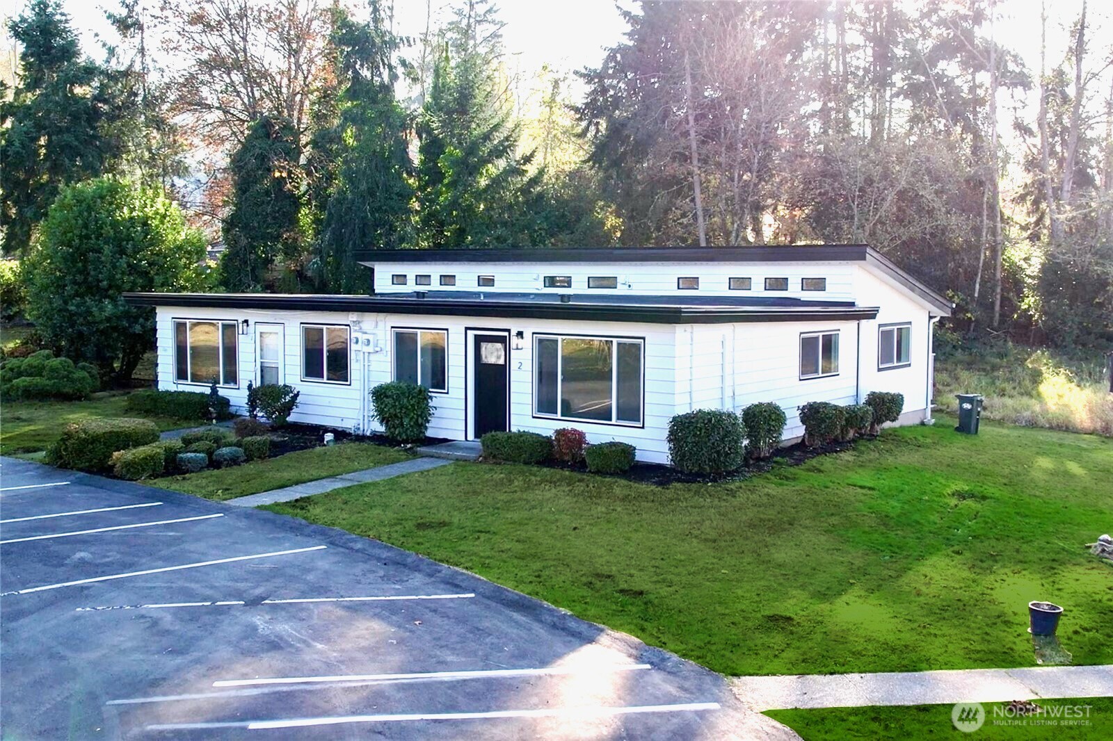 814 5th Street Steilacoom, WA 98388 - Photo 6 of 21 a view of a house with a yard and plants