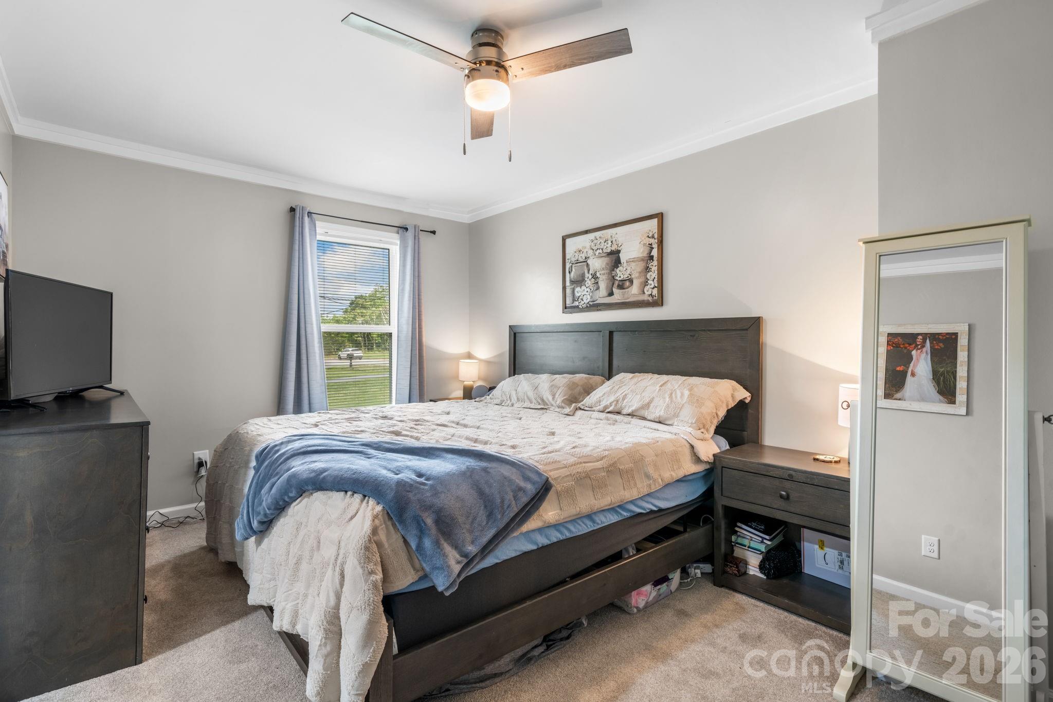 3941 Springs Road Northeast Conover, NC 28613 - Photo 11 of 21 a bedroom with a bed and a flat screen tv