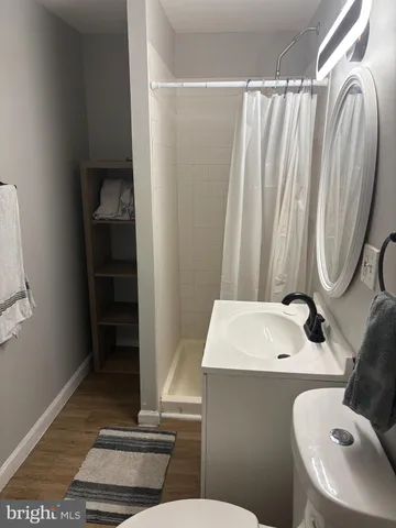 a bathroom with a sink a toilet and tub