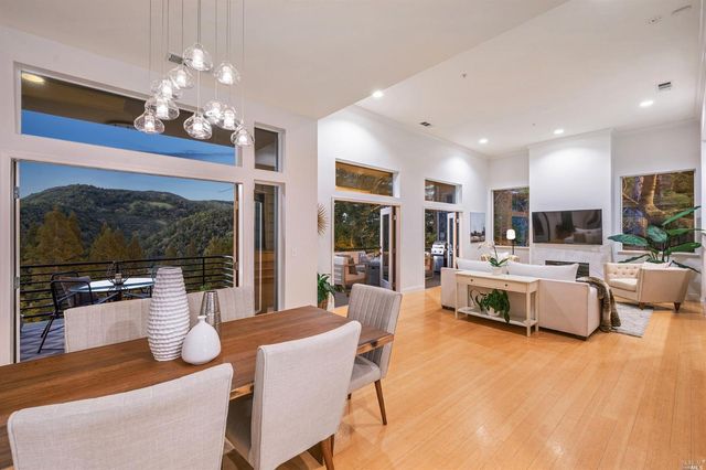 a living room with fireplace furniture and a flat screen tv