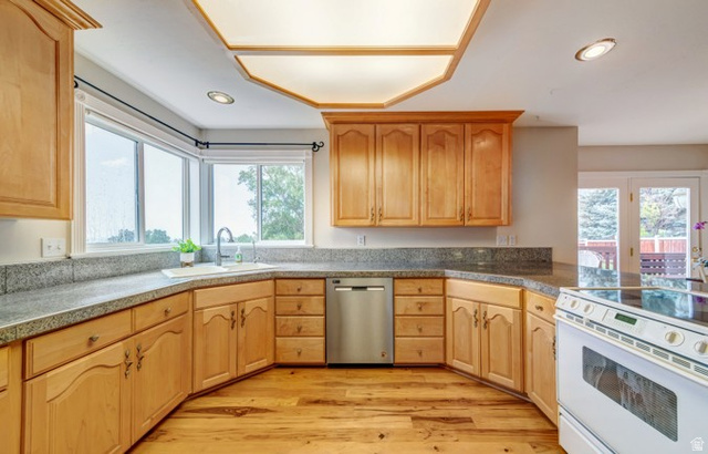 1273 Grayson Court Sandy, UT 84094 - Photo 6 of 27 Kitchen featuring wood-finish flooring, light wood cabinetry, stone countertops, a stainless steel dishwasher, and a built-in electric range