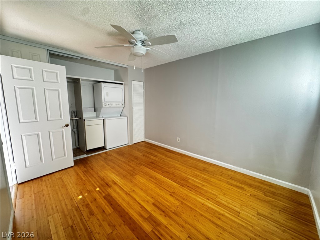 350 East Desert Inn Road, Unit C103 Las Vegas, NV 89109 - Photo 7 of 23 Hardwood flooring extends throughout this versatile living space, complete with convenient in-unit laundry.