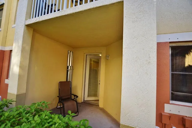 a view of a hallway with seating area