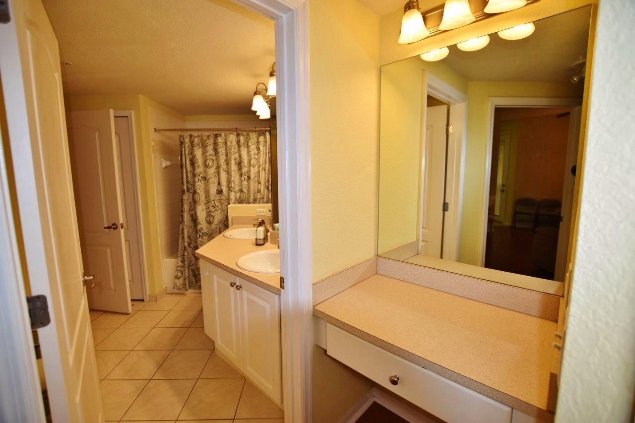 11016 Legacy Drive, Unit 103 Palm Beach Gardens, FL 33410 - Photo 15 of 44 a bathroom with a tub and a sink