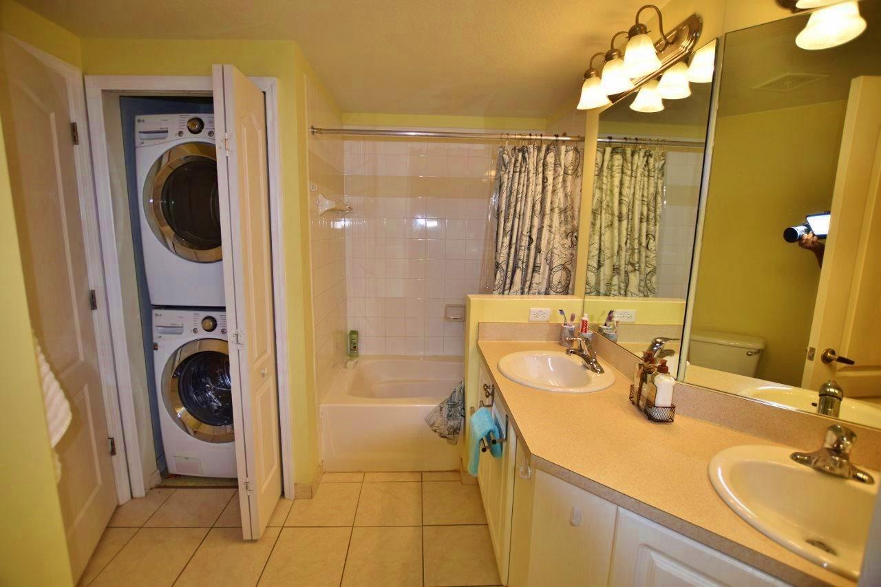 11016 Legacy Drive, Unit 103 Palm Beach Gardens, FL 33410 - Photo 19 of 44 a bathroom with a sink and a mirror
