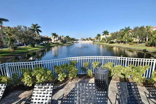 a view of a lake with outdoor seating space
