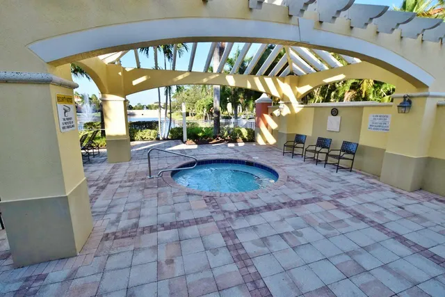 a view of a swimming pool with a patio