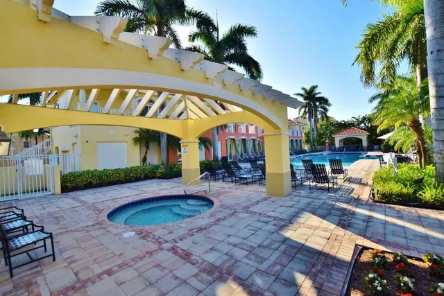 a view of a house with backyard porch and sitting area