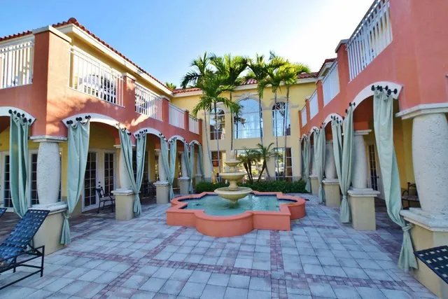 a view of a building with a yard