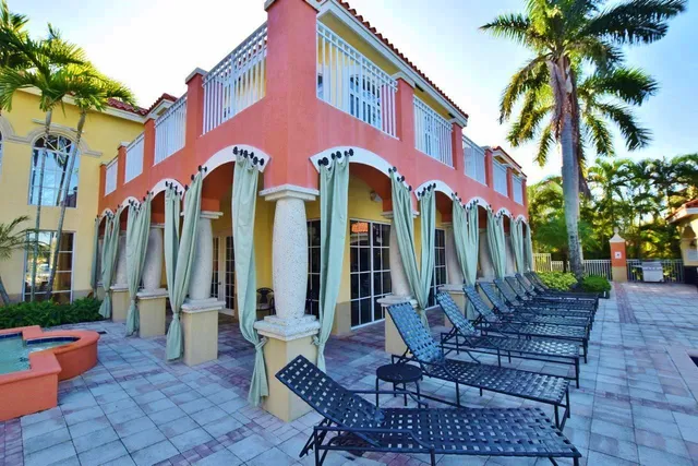 a view of a building with sitting area