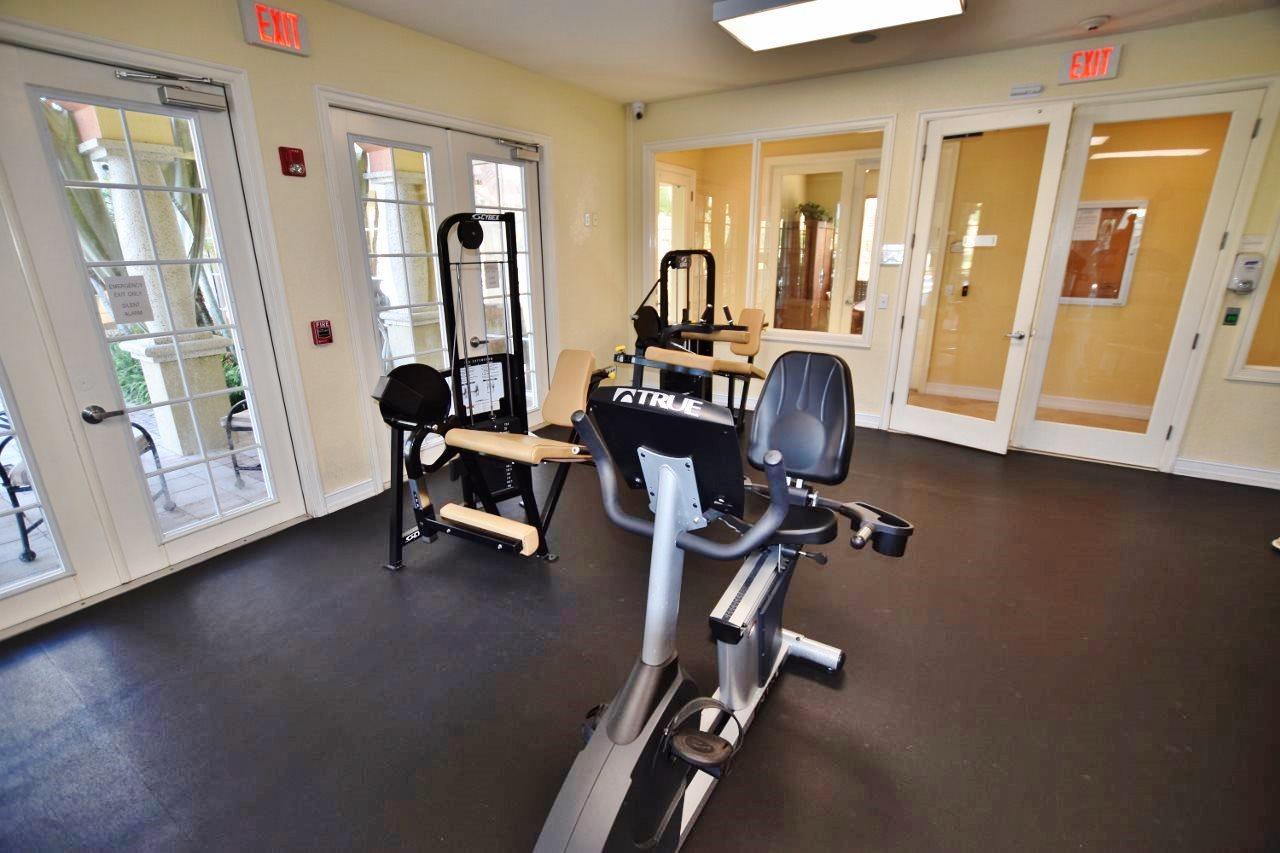 11016 Legacy Drive, Unit 103 Palm Beach Gardens, FL 33410 - Photo 38 of 44 a view of a room with gym equipment