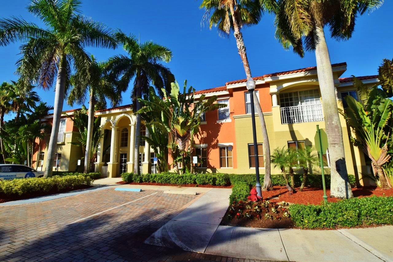 11016 Legacy Drive, Unit 103 Palm Beach Gardens, FL 33410 - Photo 41 of 44 front view of a building with a street