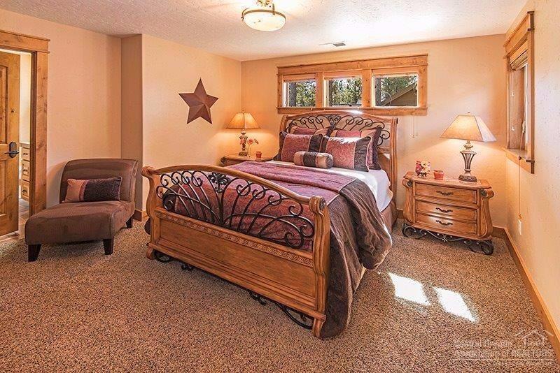 144 Sunstone Loop Bend, OR 97707 - Photo 16 of 24 Sunny queen-sized bedroom with full atta