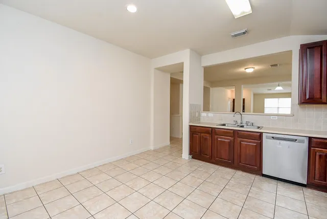 a large bathroom with a granite countertop sink and a mirror