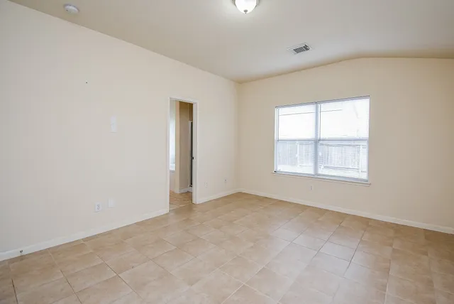 an empty room with windows