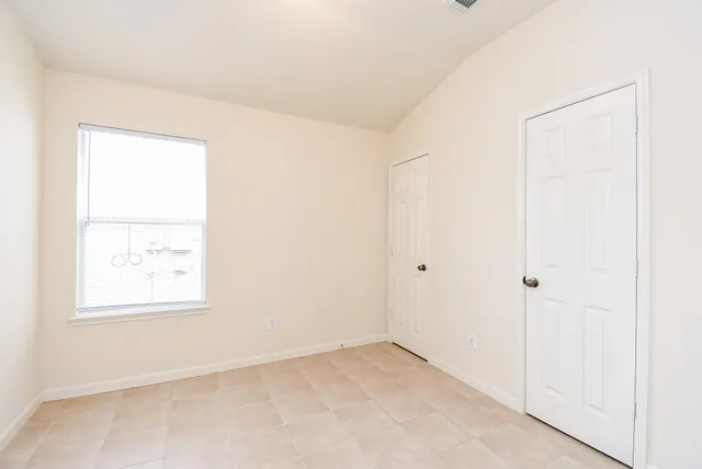 an empty room with windows