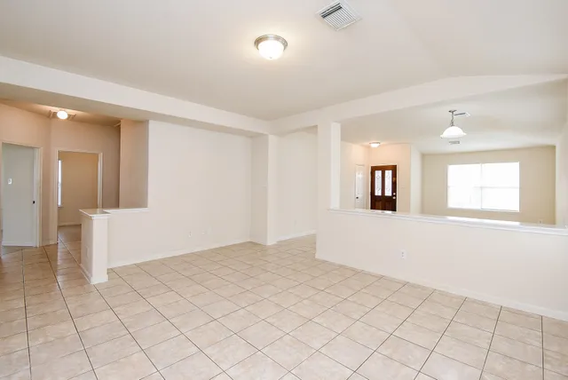 a view of an empty room and window