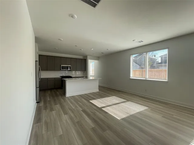 a view of a swimming pool with a yard