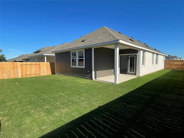 a kitchen with granite countertop a sink and a stove top oven