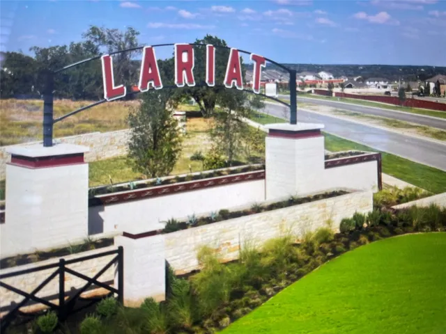 a view of kitchen with wooden floor and electronic appliances