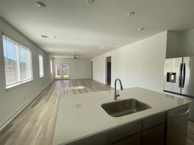 a view of a patio with a table and chairs