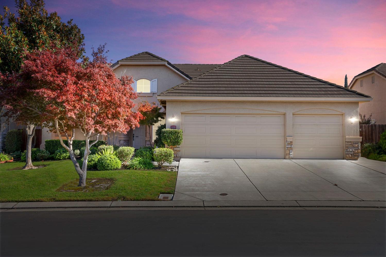 front view of a house with a small yard