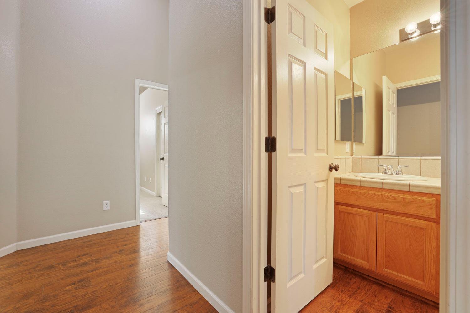 4316 Versailles Drive Modesto, CA 95356 - Photo 22 of 45 a bathroom with a sink and a mirror