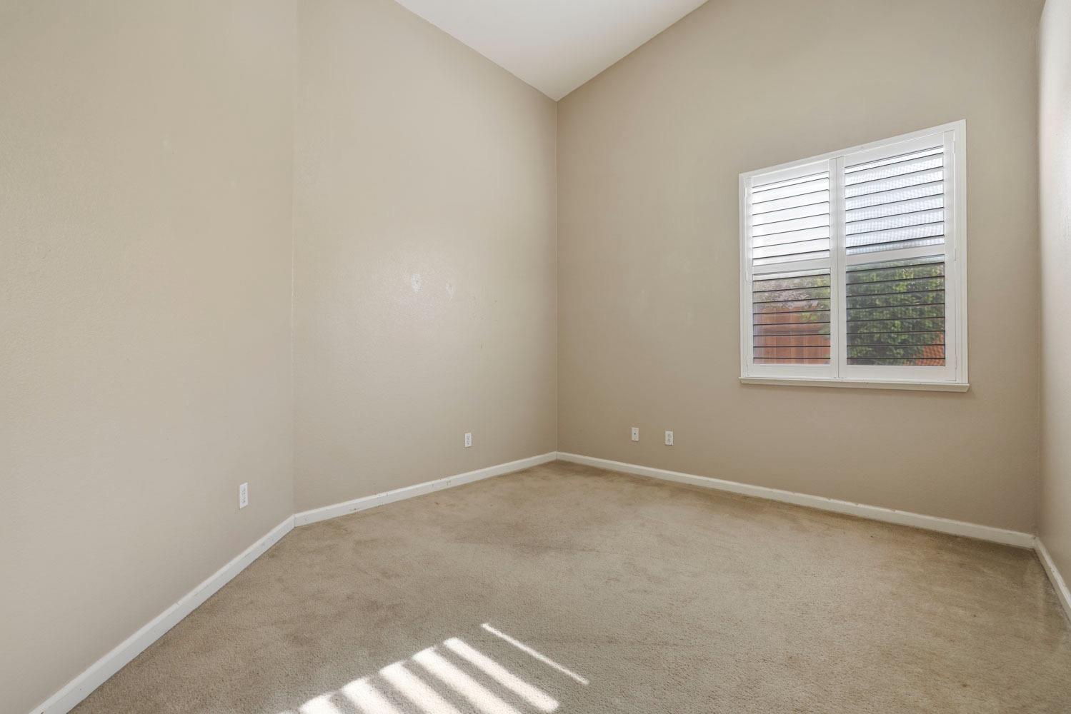 4316 Versailles Drive Modesto, CA 95356 - Photo 32 of 45 an empty room with a window