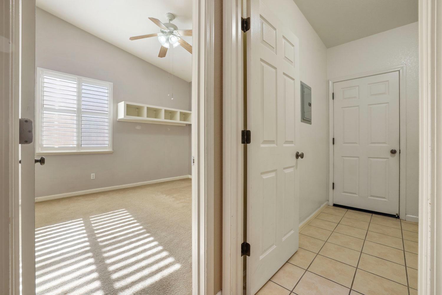4316 Versailles Drive Modesto, CA 95356 - Photo 35 of 45 a view of a bedroom with wooden floor and cabinet