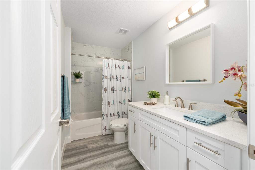 2844 Southwest 164th Street Road Ocala, FL 34473 - Photo 13 of 20 a bathroom with a sink a toilet and shower
