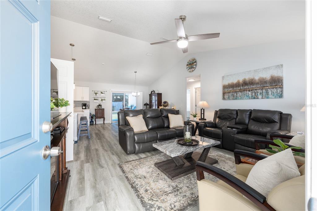 2844 Southwest 164th Street Road Ocala, FL 34473 - Photo 2 of 20 a living room with furniture and a chandelier