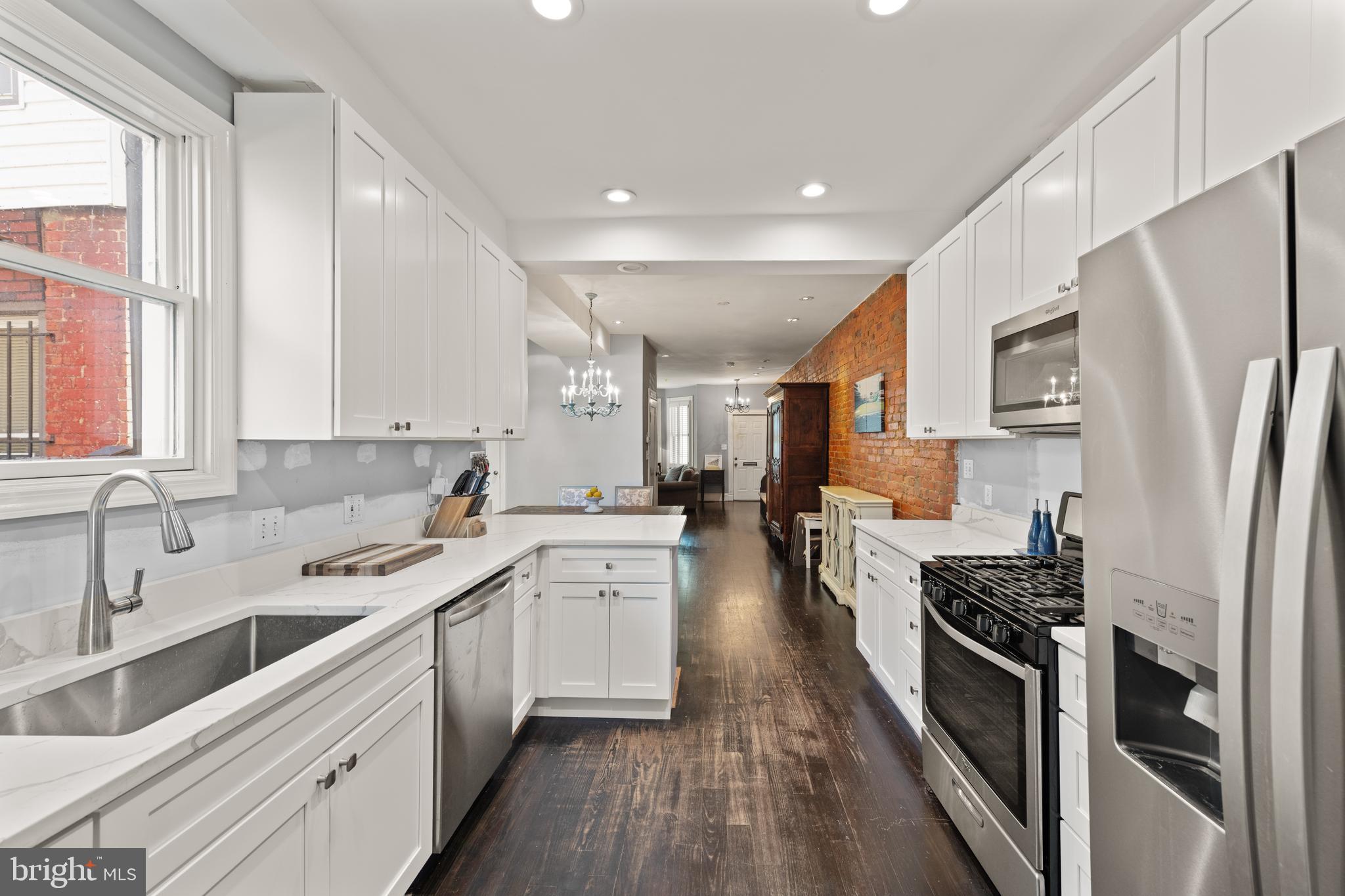 1919 6th Street Northwest Washington, DC 20001 - Photo 12 of 37 a kitchen with stainless steel appliances a stove sink and refrigerator
