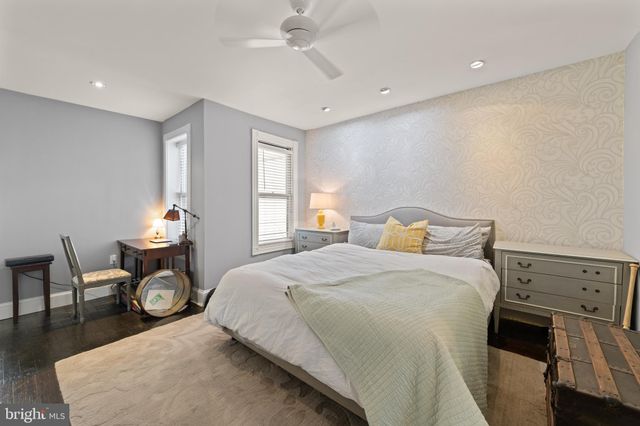 a bedroom with bed and window