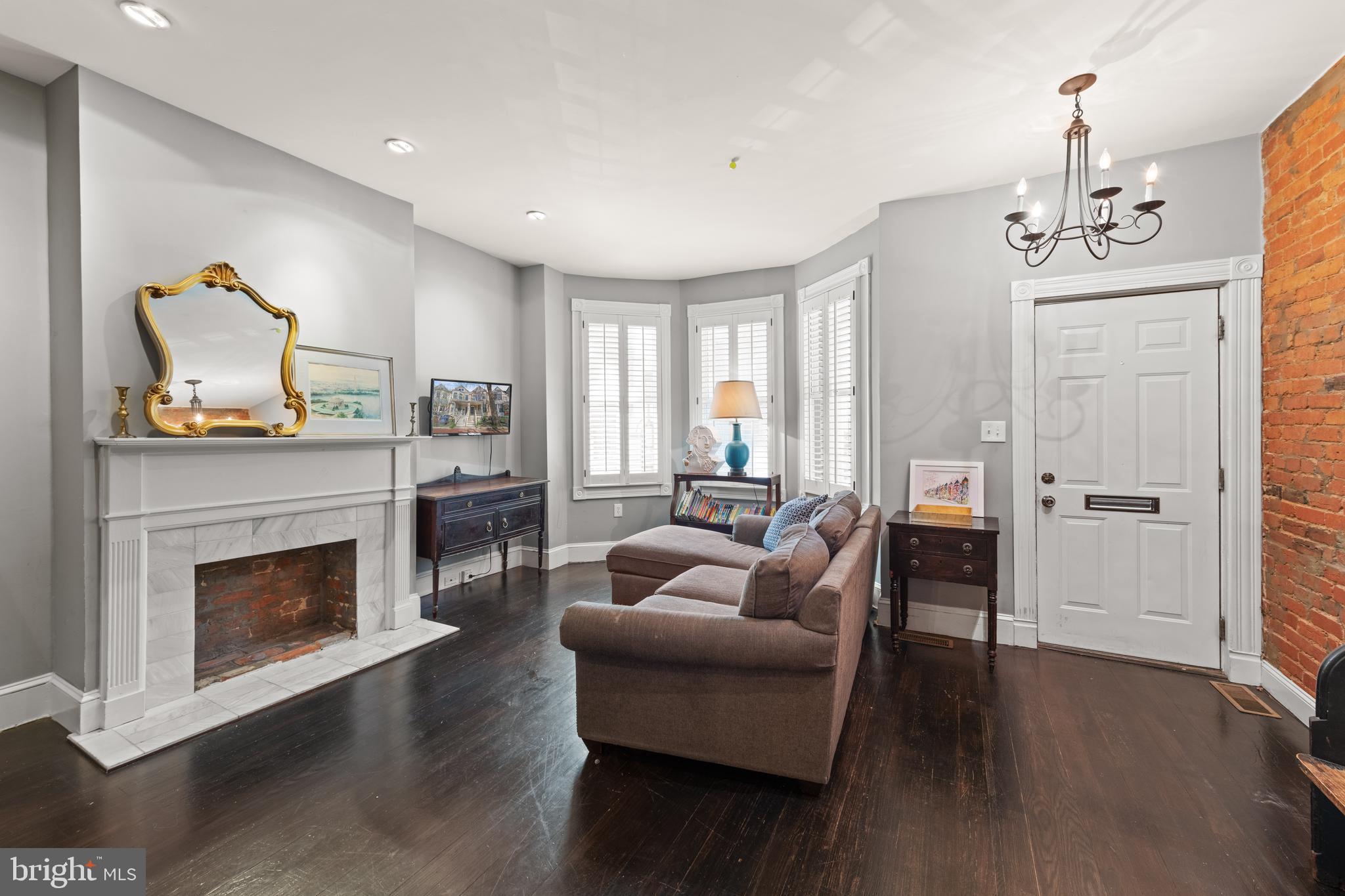 1919 6th Street Northwest Washington, DC 20001 - Photo 4 of 37 a living room with furniture and a fireplace
