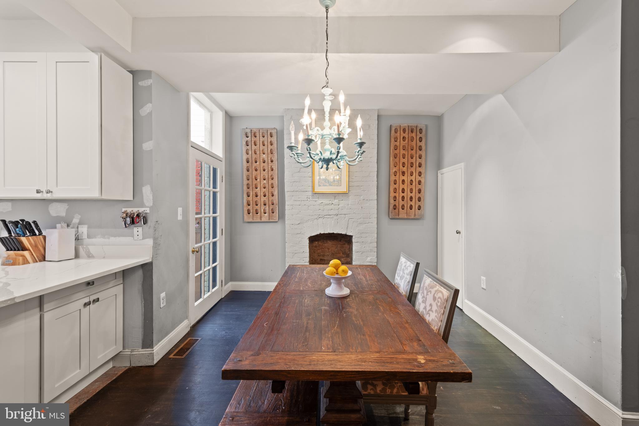 1919 6th Street Northwest Washington, DC 20001 - Photo 9 of 37 a dining room with furniture a chandelier and wooden floor