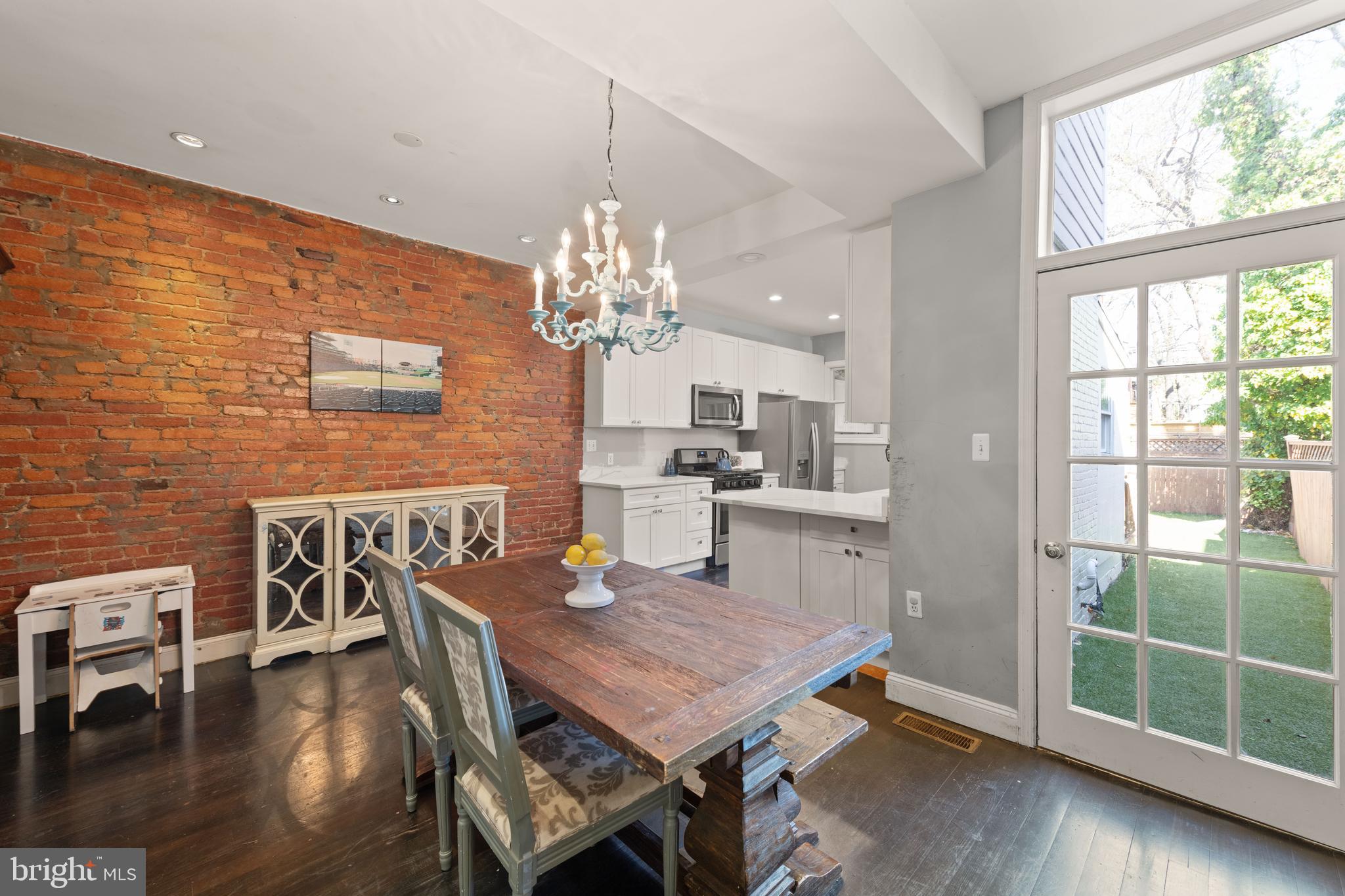 1919 6th Street Northwest Washington, DC 20001 - Photo 10 of 37 a view of a dining room with furniture wooden floor and chandelier