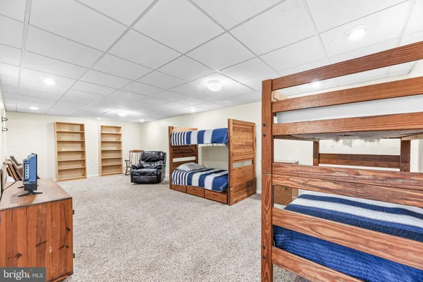 a room with furniture and a ceiling fan
