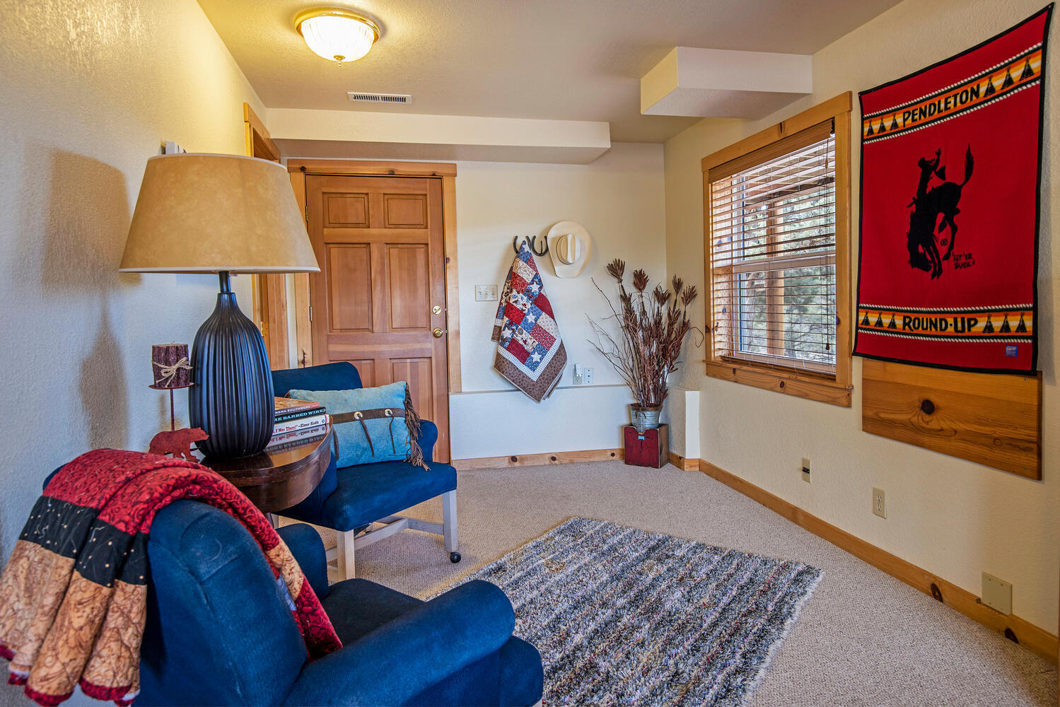 70700 Holmes Road Sisters, OR 97759 - Photo 28 of 53 Downstairs, 384 SF includes a carpeted guest bedroom with its own private access and a laundry room with a washer & dryer