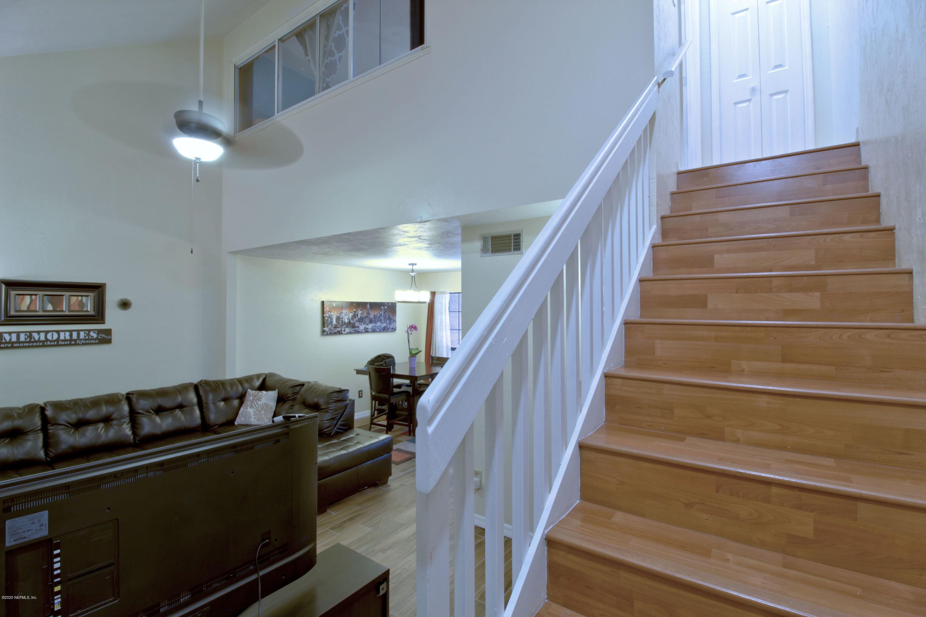 910 Southwest 57 Terrace Gainesville, FL 32607 - Photo 13 of 18 a view of entryway with wooden floor