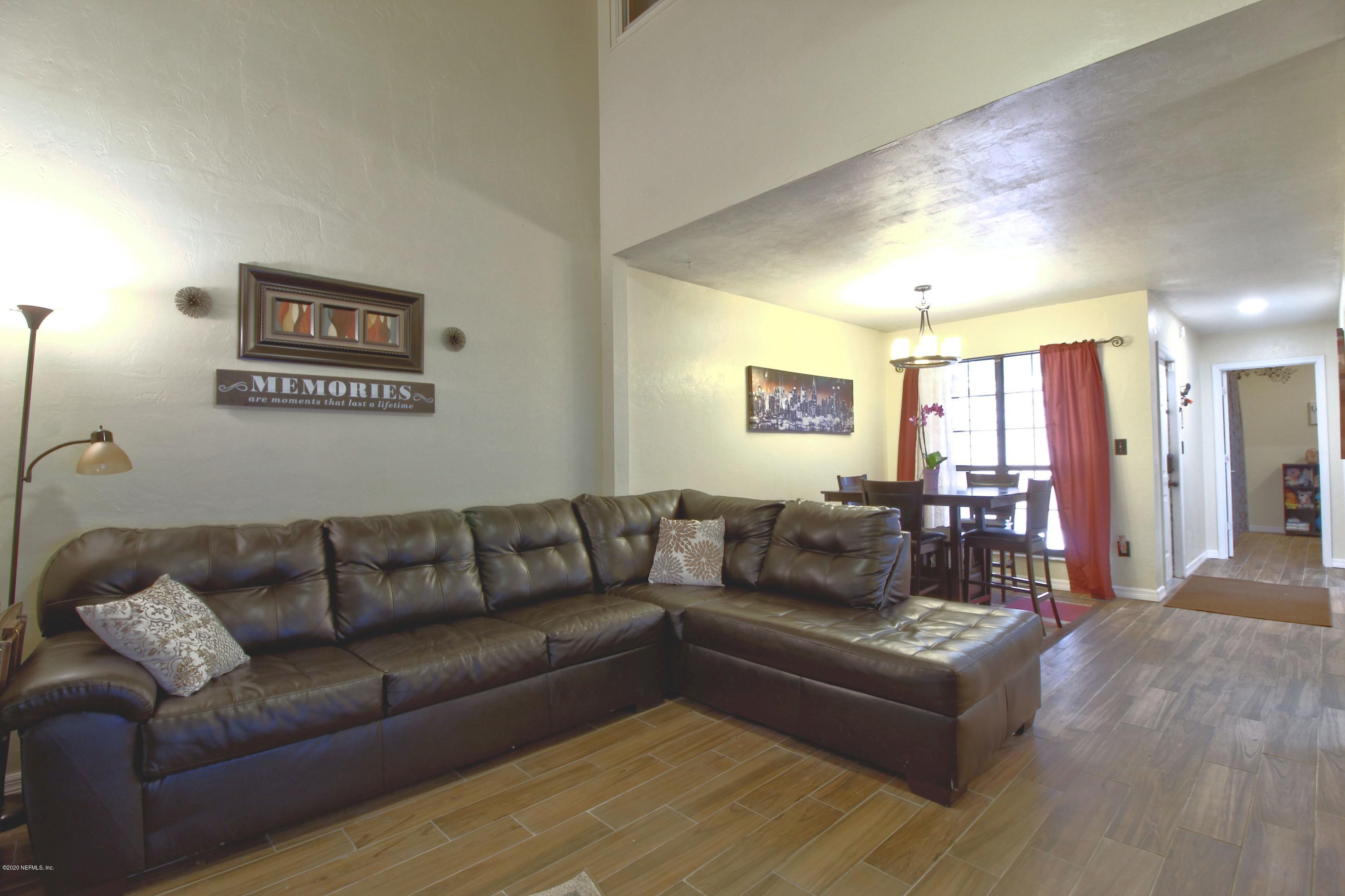 910 Southwest 57 Terrace Gainesville, FL 32607 - Photo 14 of 18 a living room with furniture and a couch