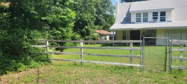 a view of outdoor space with deck and tree