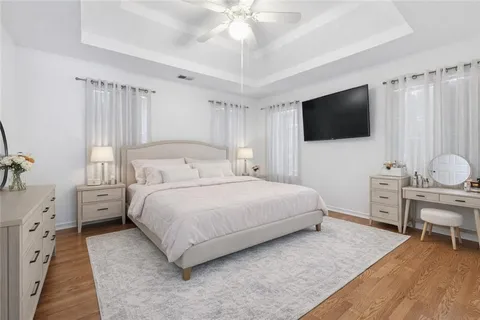 a bedroom with bed and a potted plant