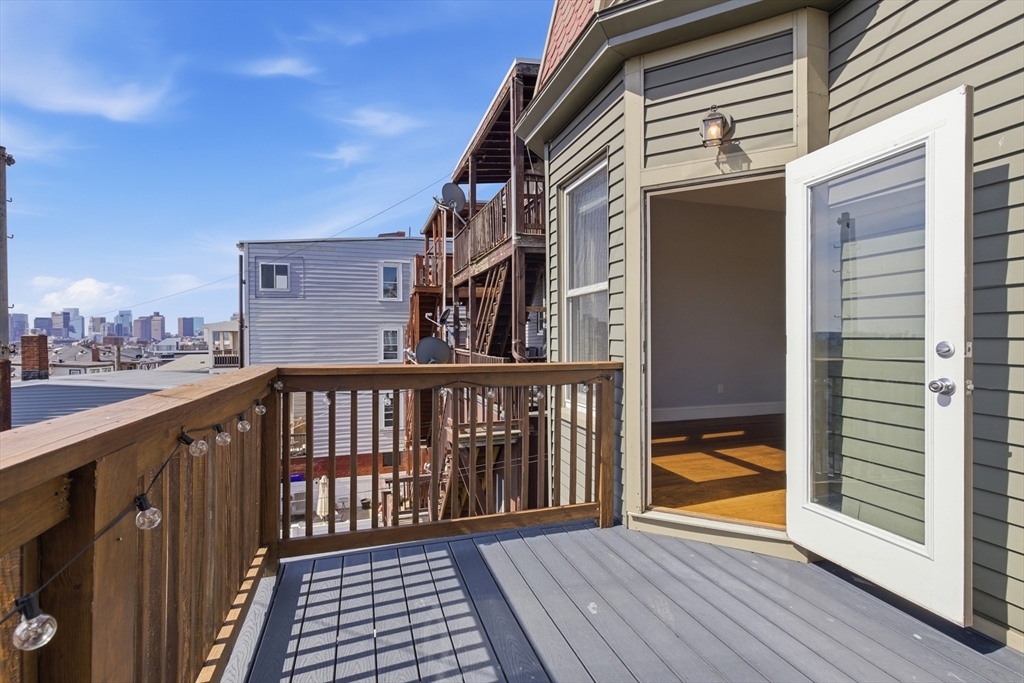 249 Lexington Street, Unit 2 Boston, MA 02128 - Photo 23 of 24 a balcony view with a wooden floor