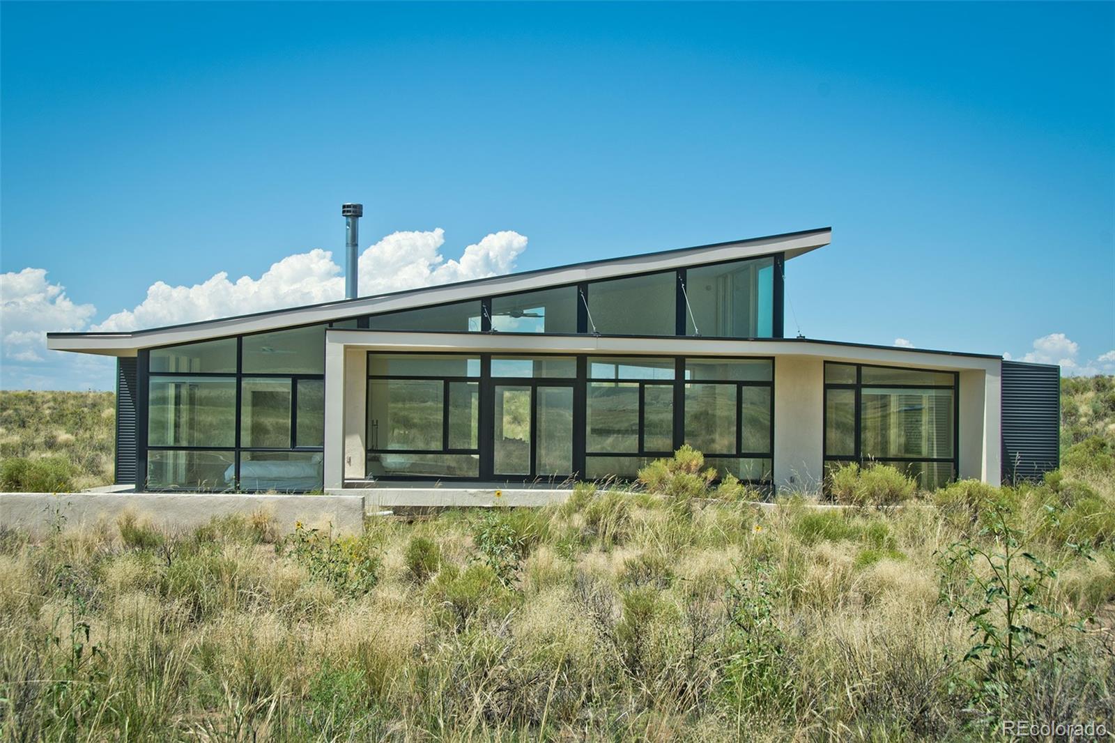 790 Birch Road Crestone, CO 81131 - Photo 1 of 38 a front view of house with yard