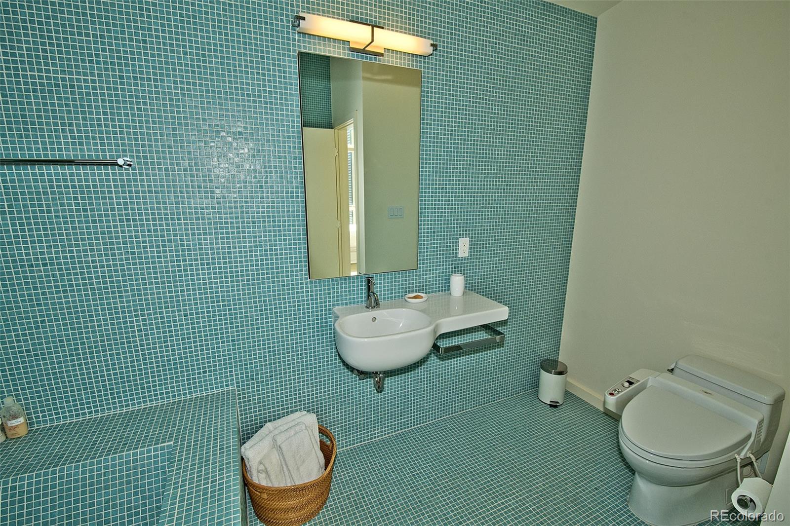 790 Birch Road Crestone, CO 81131 - Photo 21 of 38 a bathroom with a toilet sink and mirror