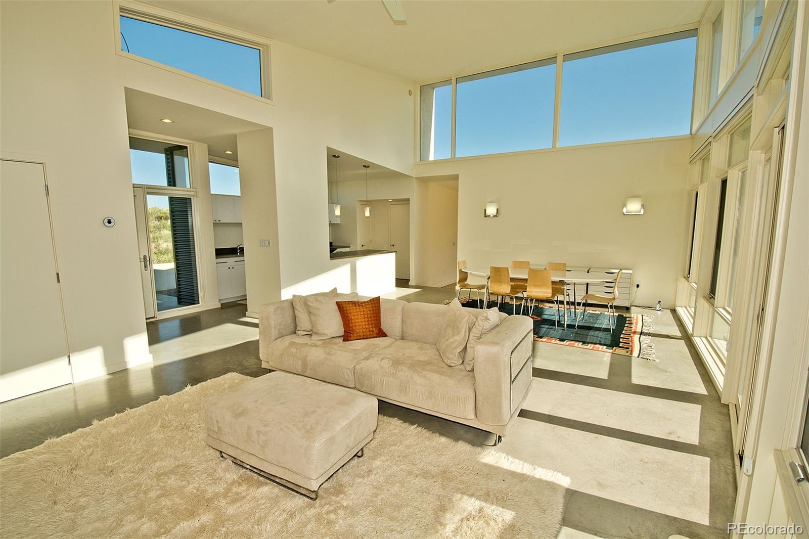 790 Birch Road Crestone, CO 81131 - Photo 3 of 38 a living room with furniture and a large window