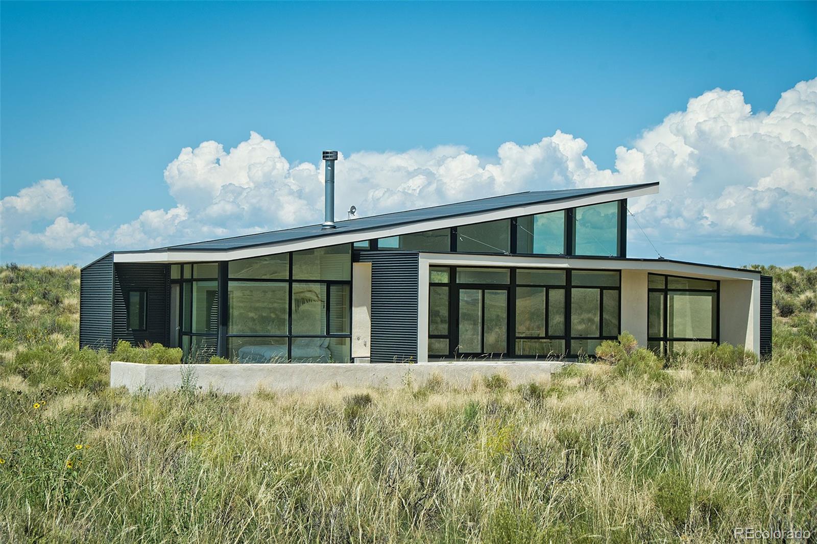 790 Birch Road Crestone, CO 81131 - Photo 34 of 38 a view of a house with backyard
