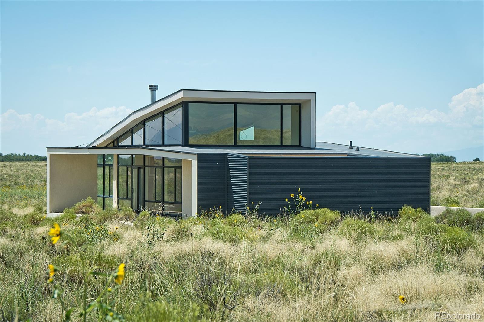 790 Birch Road Crestone, CO 81131 - Photo 35 of 38 a view of a house with a yard