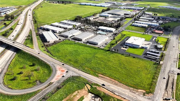 an aerial view of a residential houses with outdoor space and swimming pool