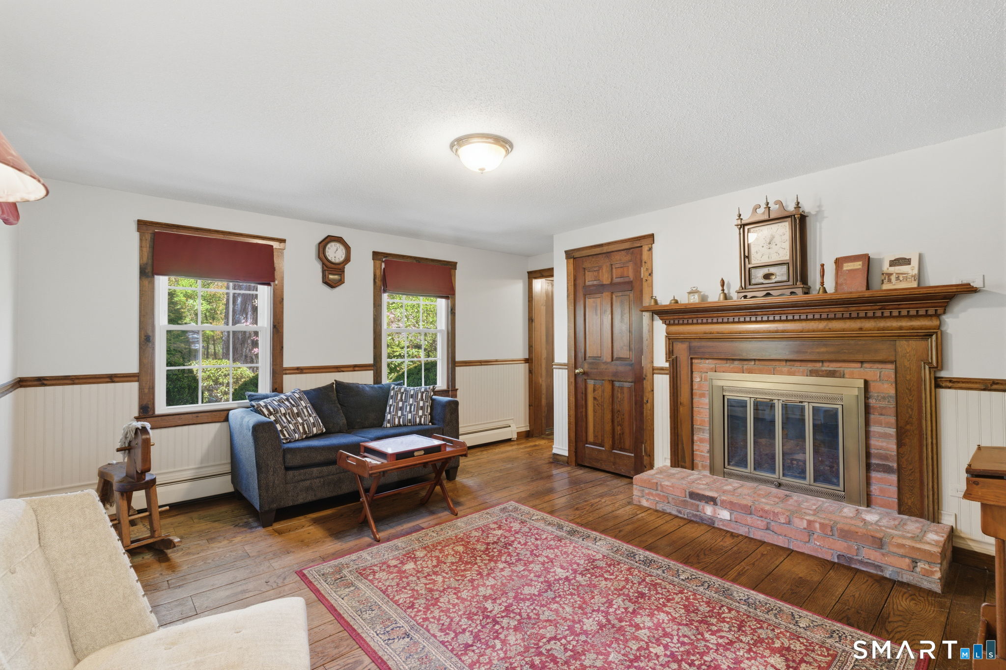79 Buckboard Lane Bristol, CT 06010 - Photo 21 of 40 a living room with furniture and a fireplace